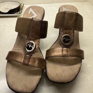 Anne Klein wedge sandals with gold trim.